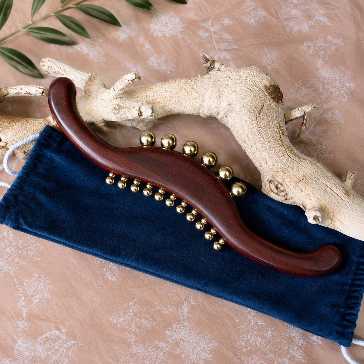 Wood and brass massage wand with soft velvet gift pouch, ready to give