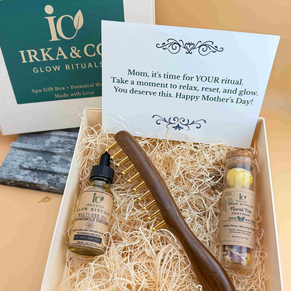 Ebony and brass scalp massage comb, botanical infused oil and blooming tea from the Irka & Co Scalp Revitalization Ritual Set