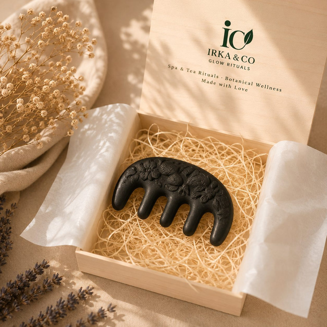 Wooden scalp massage comb resting in an open Irka & Co Glow Rituals gift box