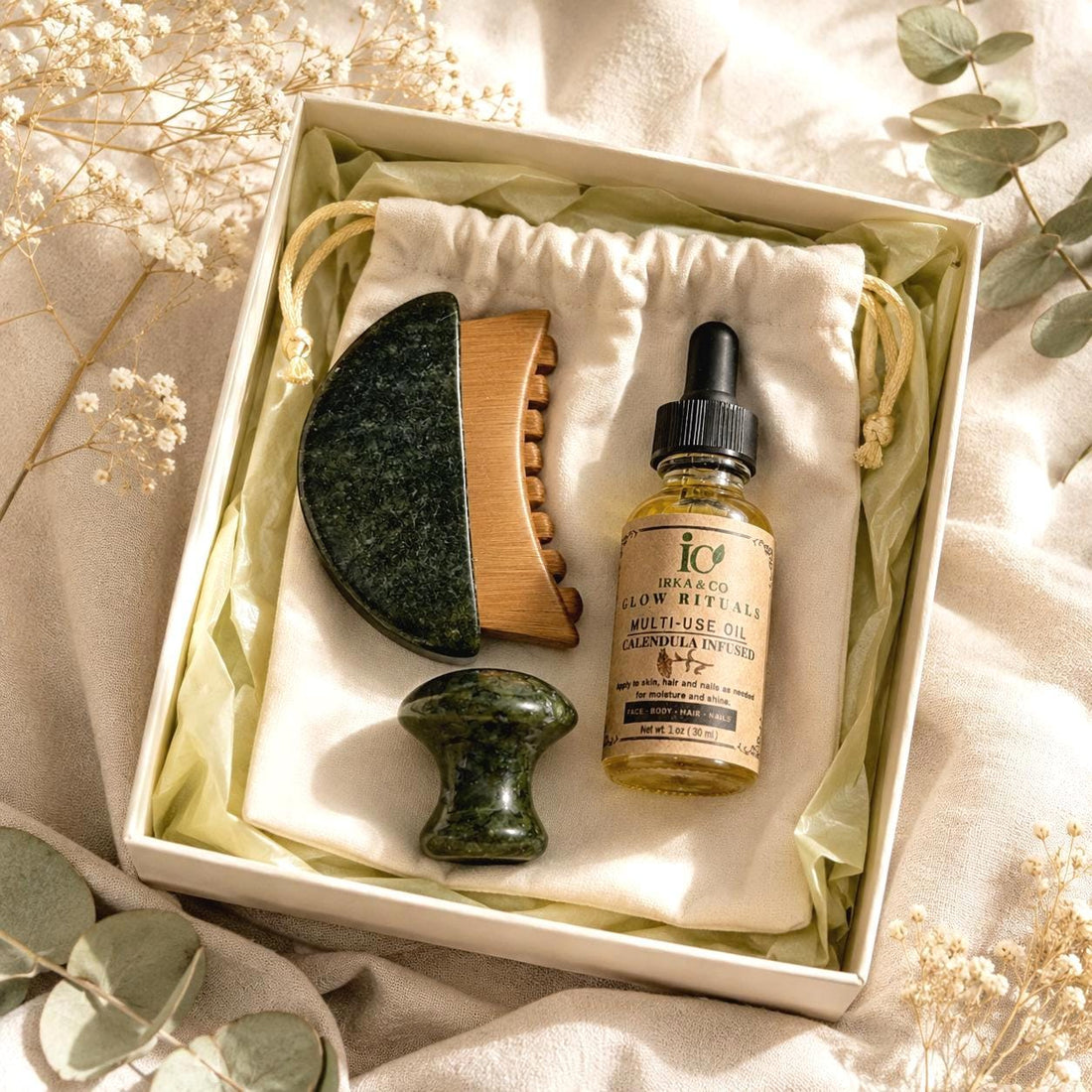 Jade gua sha brush, jade mushroom massager and botanical infused oil from the Irka & Co Jade Gua Sha & Scalp Ritual Set