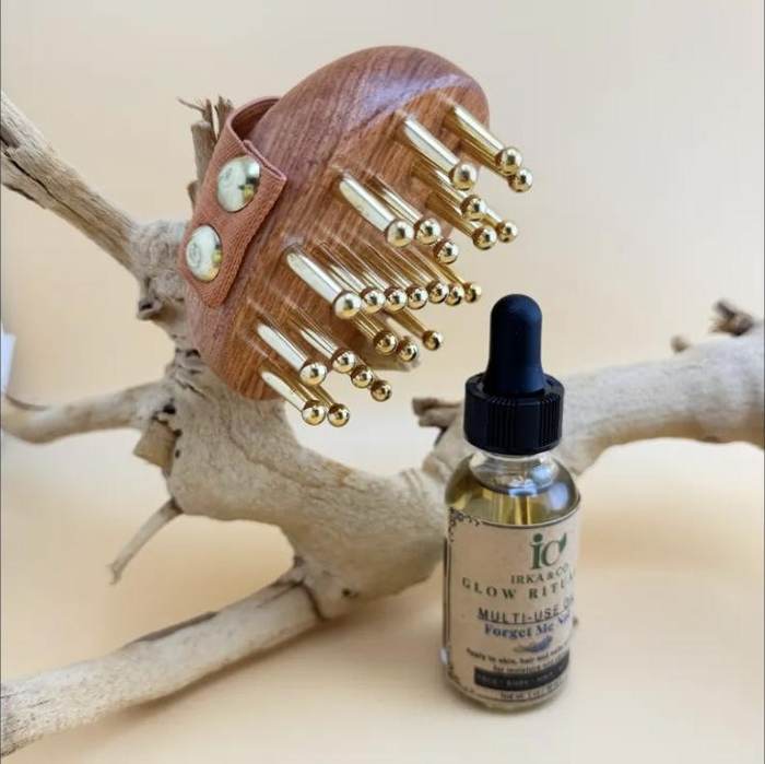 Brass meridian massage brush with twenty-two solid brass nodes set into a compact hardwood body