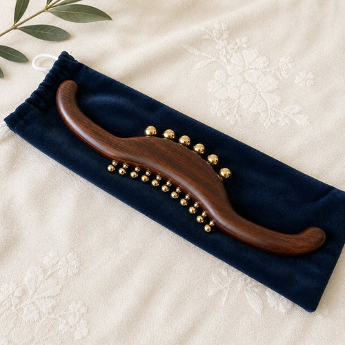 Wood and brass back massage wand with S-curve design for spine, neck and legs, by Irka & Co
