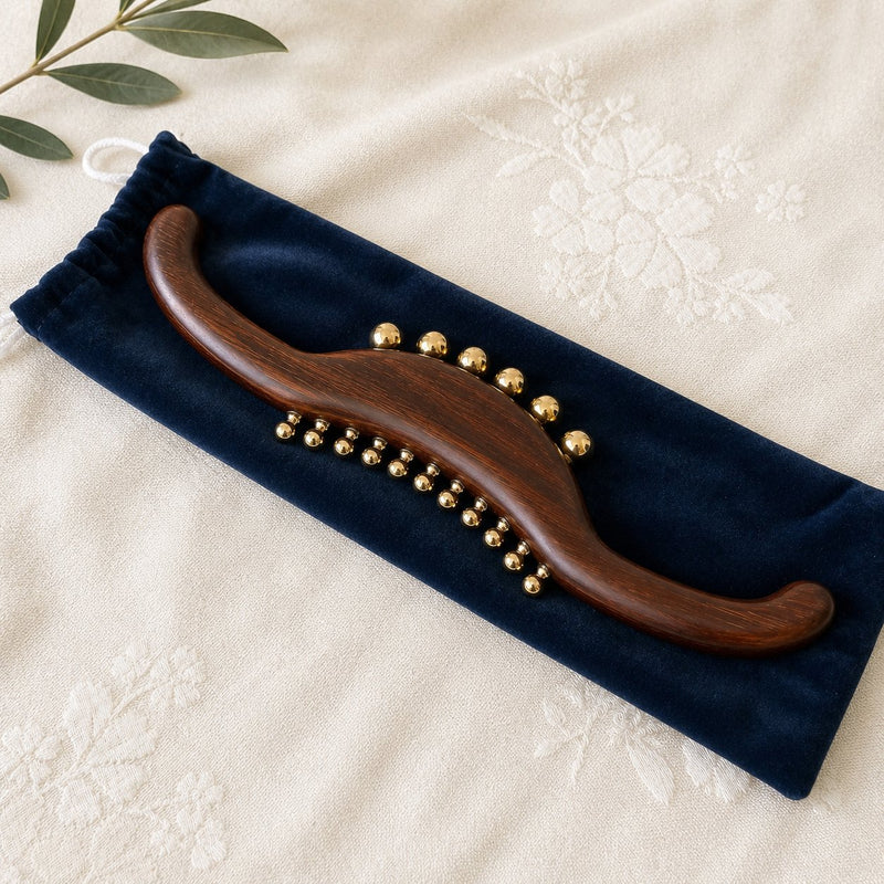 Wood and brass back massage wand with S-curve design for spine, neck and legs, by Irka & Co