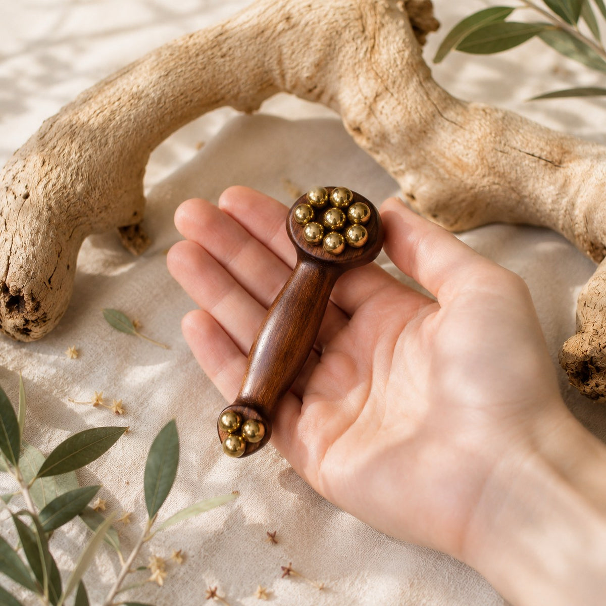 Handcrafted brass and wood roller from Irka & Co Glow Rituals