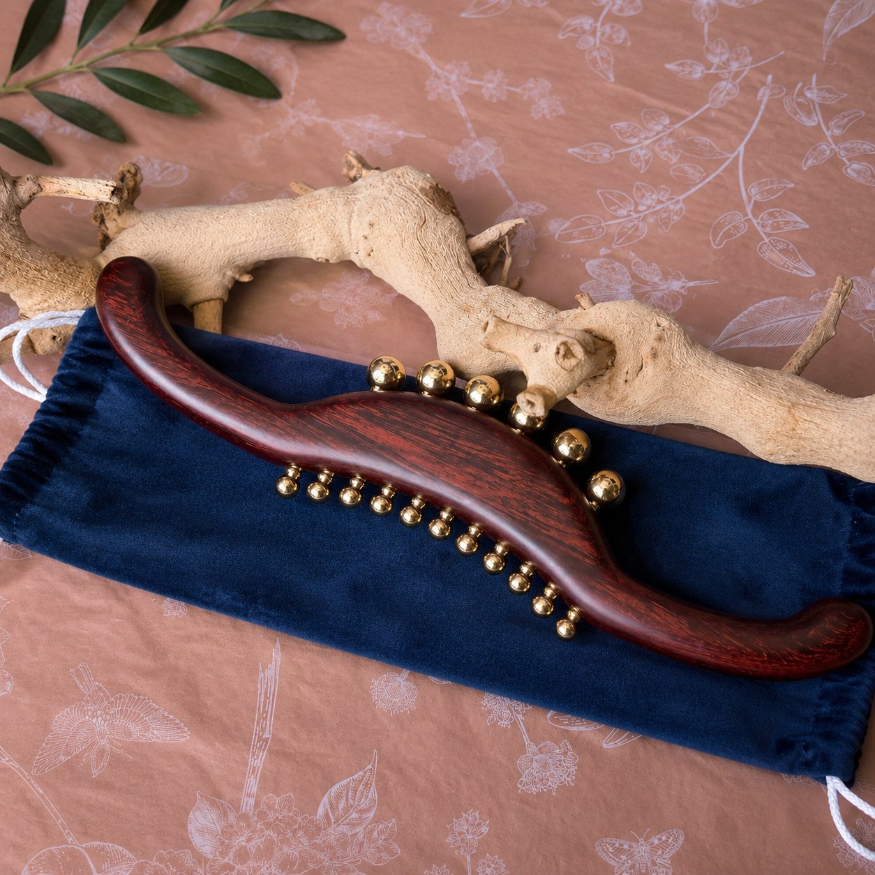 Wood and brass body massager styled for a back, neck and leg tension relief ritual