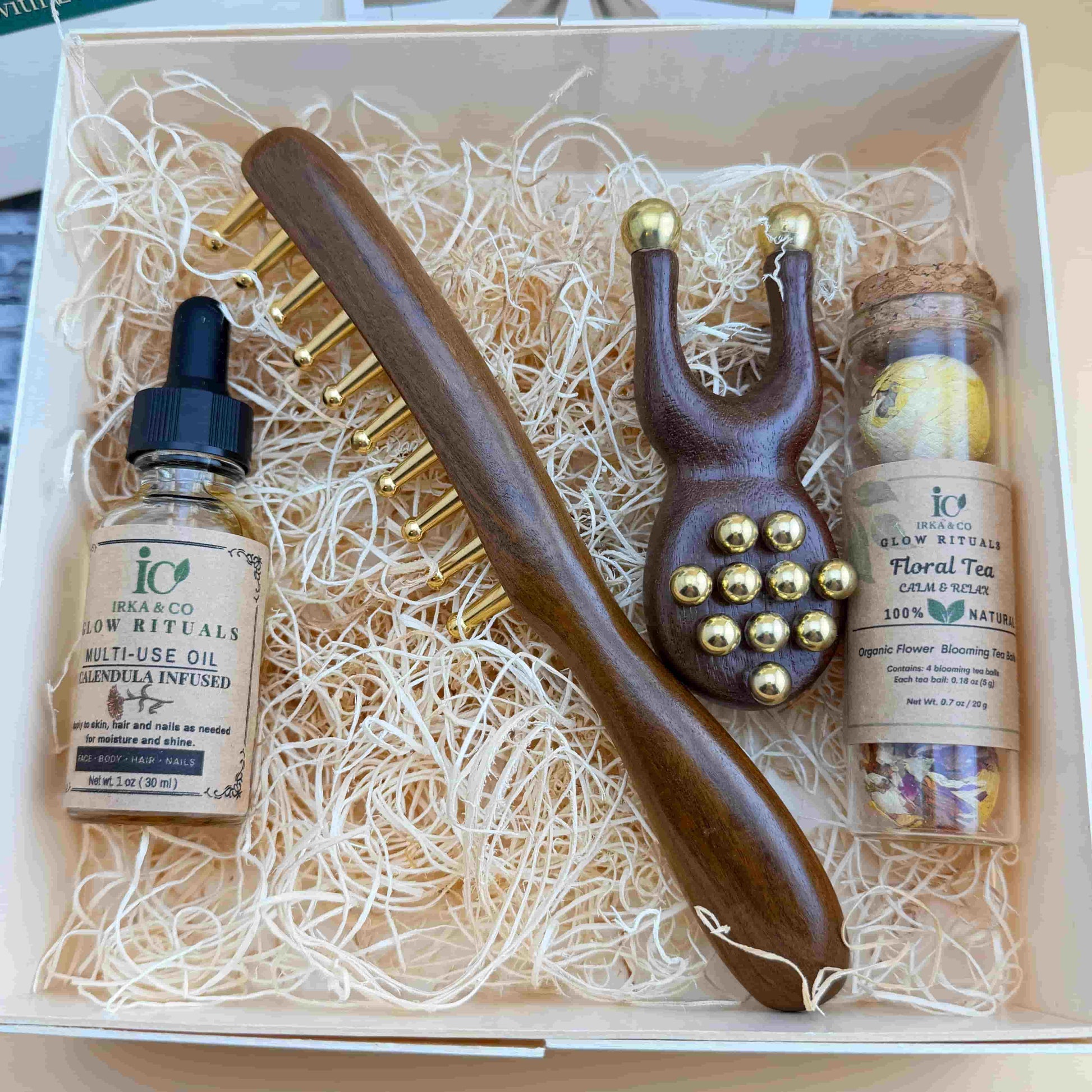 Ebony wood scalp massage comb and copper frog facial tool for relaxation and circulation
