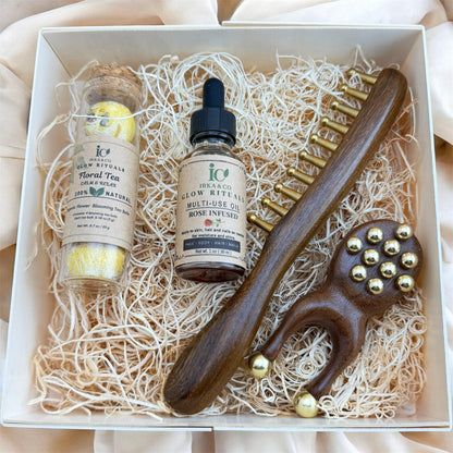 Self care ritual set with massage tools, body oil and blooming tea for relaxation and stress relief