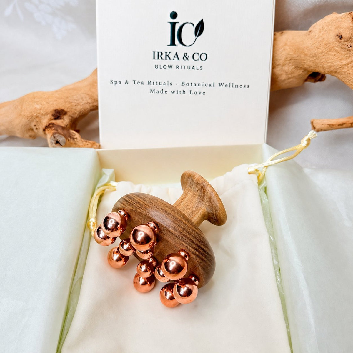 Copper cluster massage tool in an Irka & Co Glow Rituals gift box with cotton pouch
