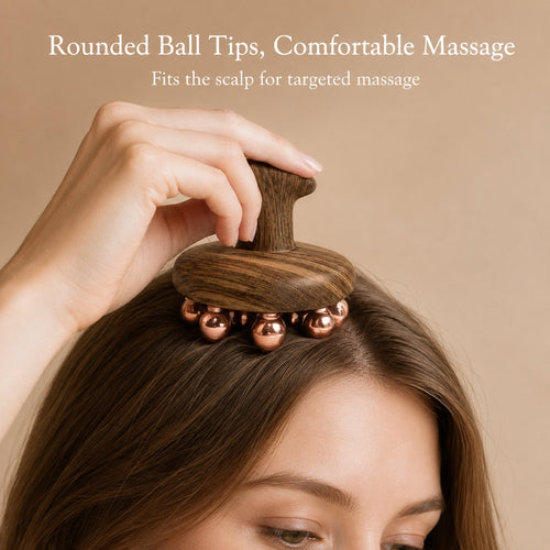 Woman using the copper cluster tool for a scalp massage, rounded copper ball tips against the hairline