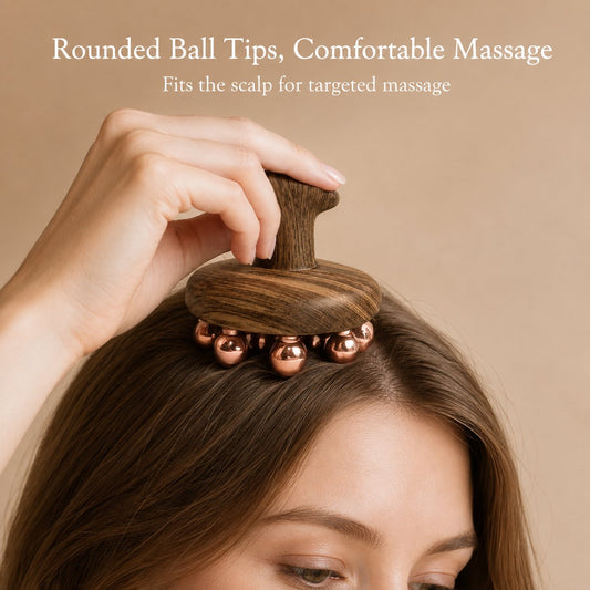 Woman using the copper cluster tool for a scalp massage, rounded copper ball tips against the hairline