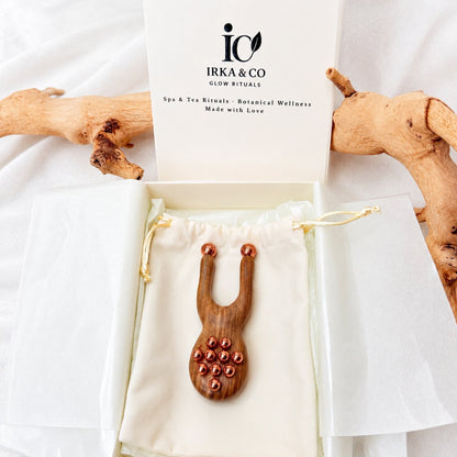Facial lift massager presented in a sage green gift box with a keepsake pouch