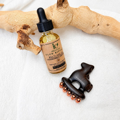 Little Horse facial massage tool next to a bottle of Irka & Co Glow Rituals Chamomile Infused Multi-Use Oil