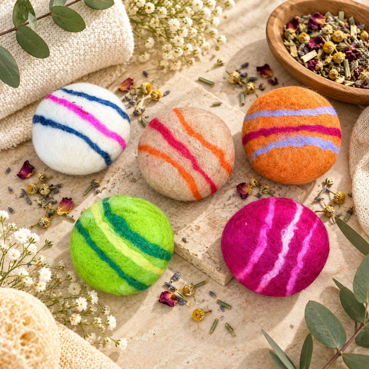 Felted wool soap balls in five herbal scents, wrapped in colorful wool felt