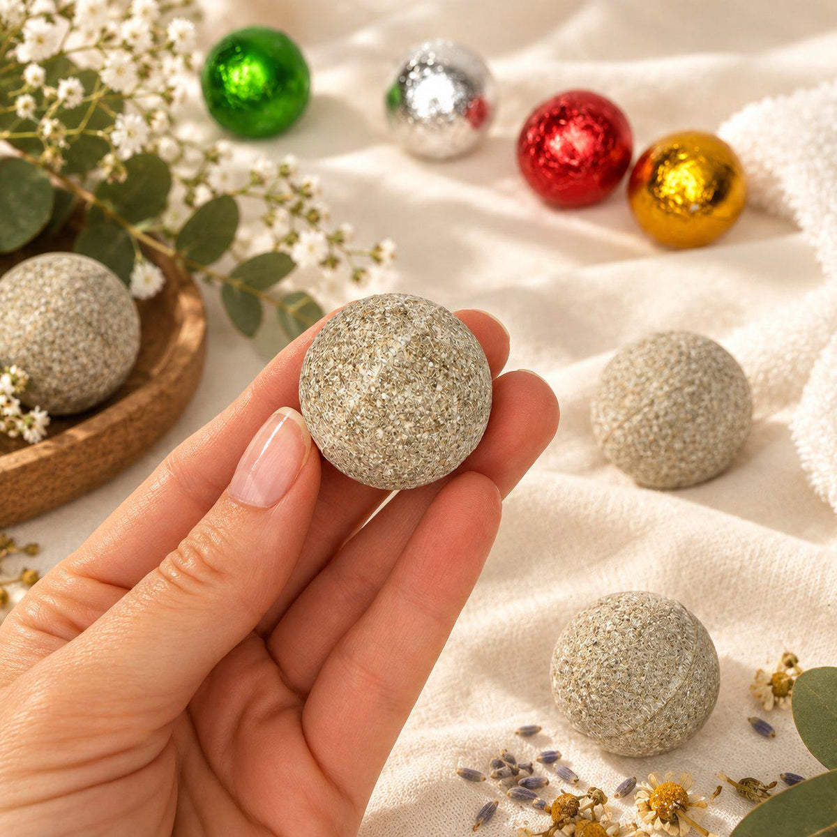 Pressed herbal foot soak ball unwrapped, showing the dried herbs