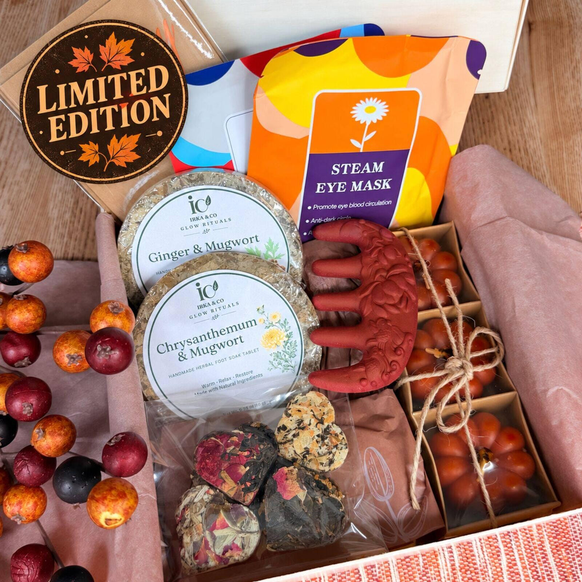 Autumn self care gift box styled with fall leaves and a warm cup of tea