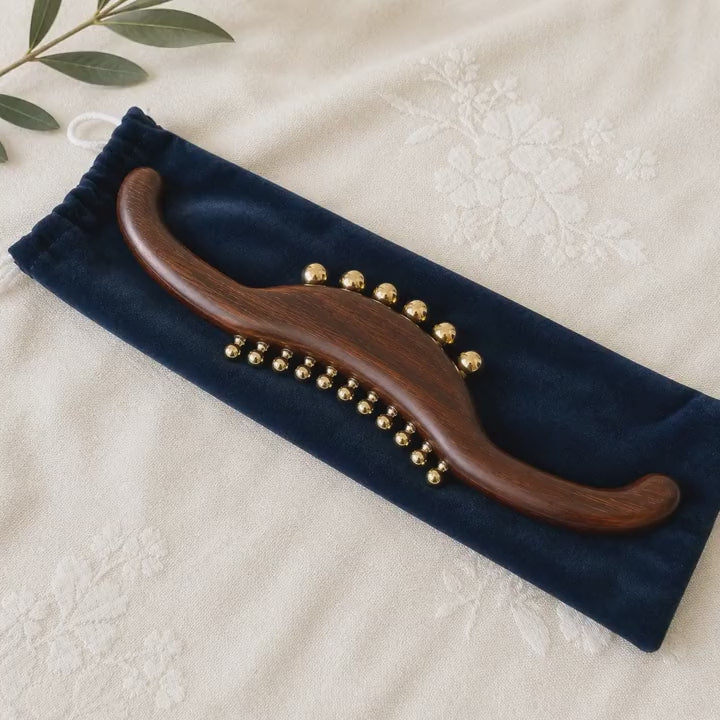 Full Body Lymphatic Drainage Massage Wand in use, demonstrating the 14-inch wood and brass wand for back, neck and leg massage