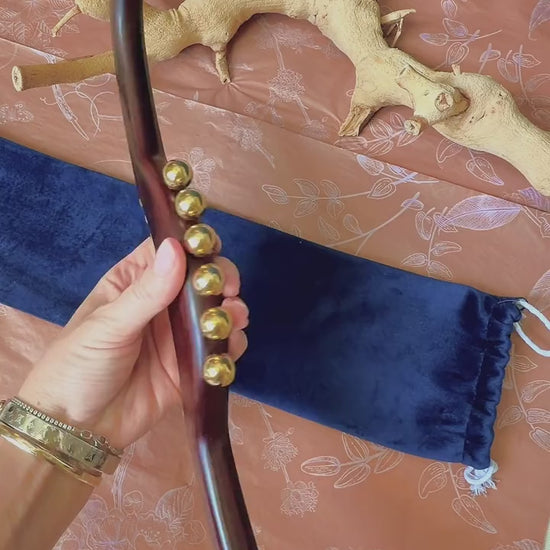 Close-up of the 17 solid brass beads on the Full Body Lymphatic Drainage Massage Wand, showing the two bead sizes for different massage intensities