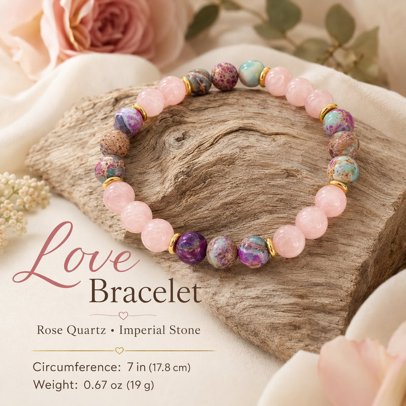 Rose Quartz & Imperial Stone Love Bracelet detail, resting on driftwood with pink roses